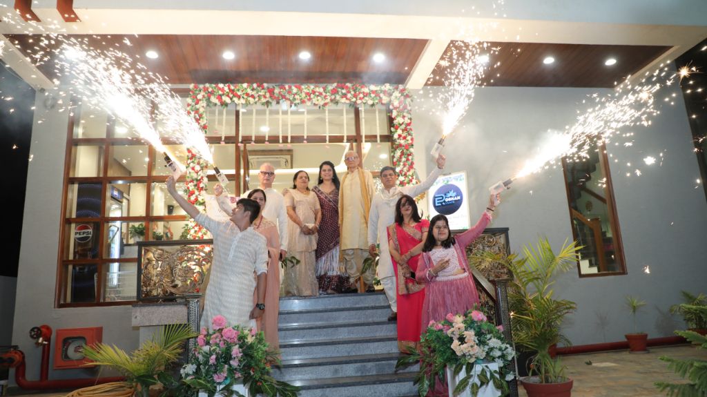 Roshan Events Team celebrating at an event with sparklers